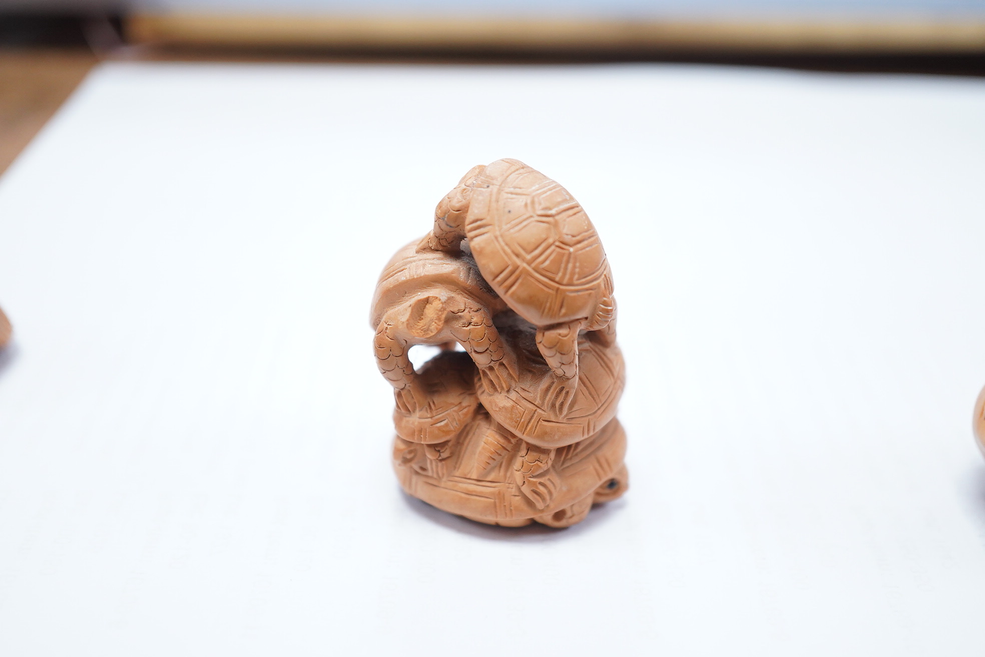 Three Japanese carved and signed boxwood netsukes, largest 5cm. Condition - two tortoises missing heads